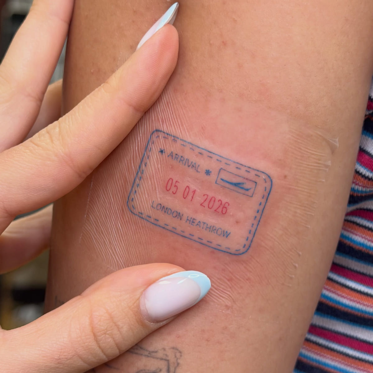 Passport stamp, ARRIVAL 05 01 2026 LONDON HEATHROW, fine line tattoo
