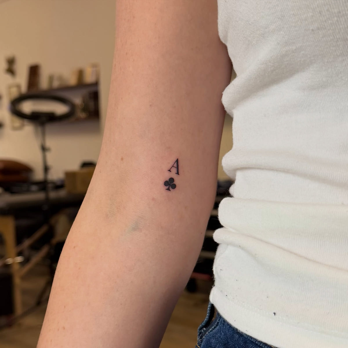 Ace of clubs, letter and suit, fine line tattoo