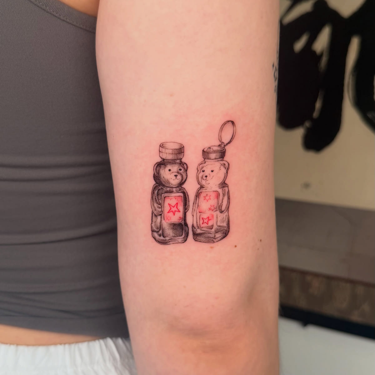 Two honey bear bottles, red labels with stars, another view
