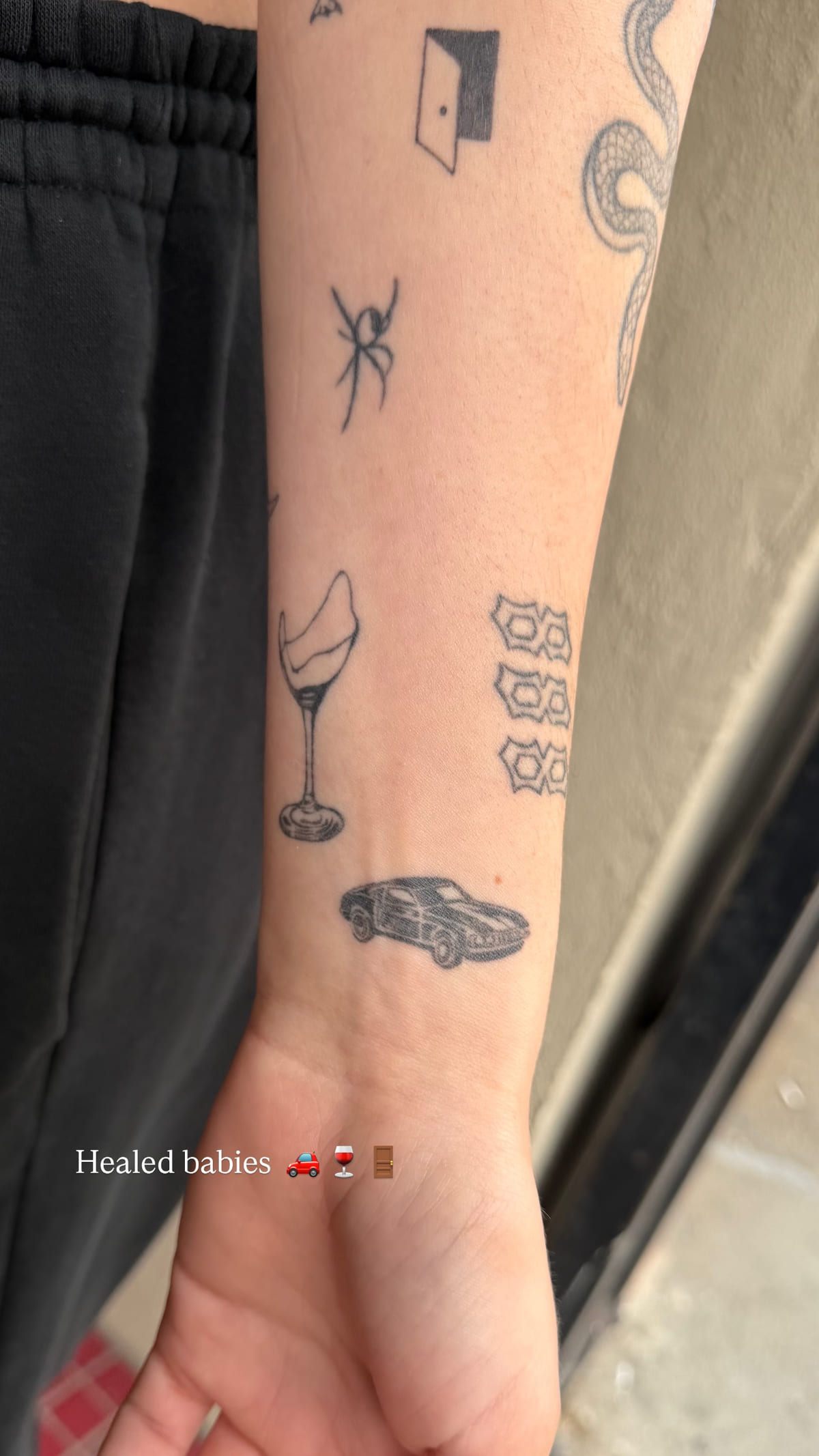 Inner forearm of small pieces, healed fine line tattoo