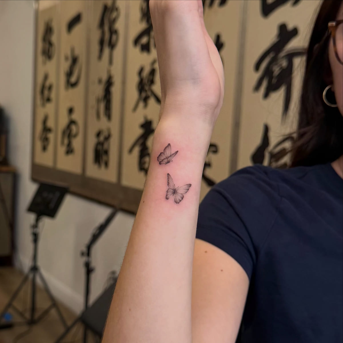 Two tiny butterflies, fine line tattoo